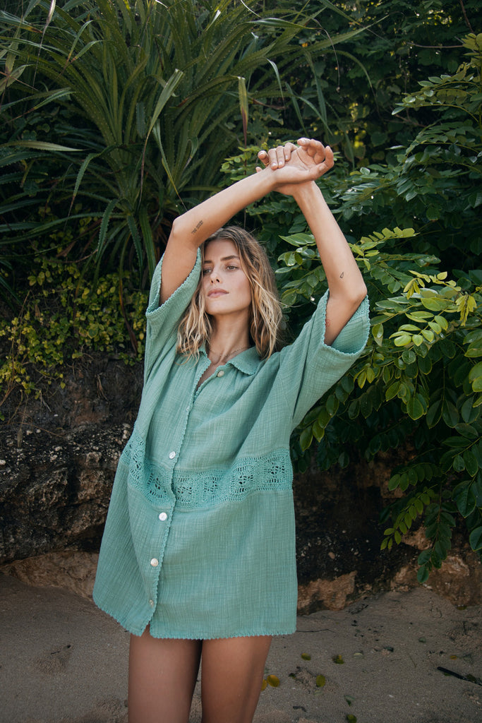 model wearing cotton teal shirt 