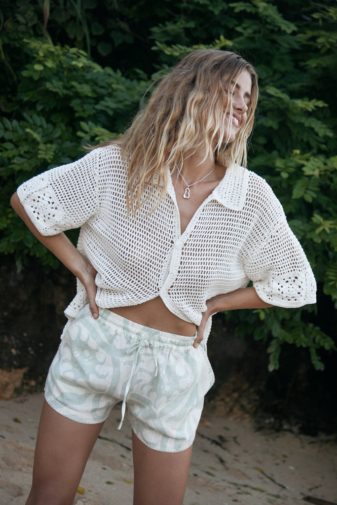 Model wearing silver organic pendant necklace